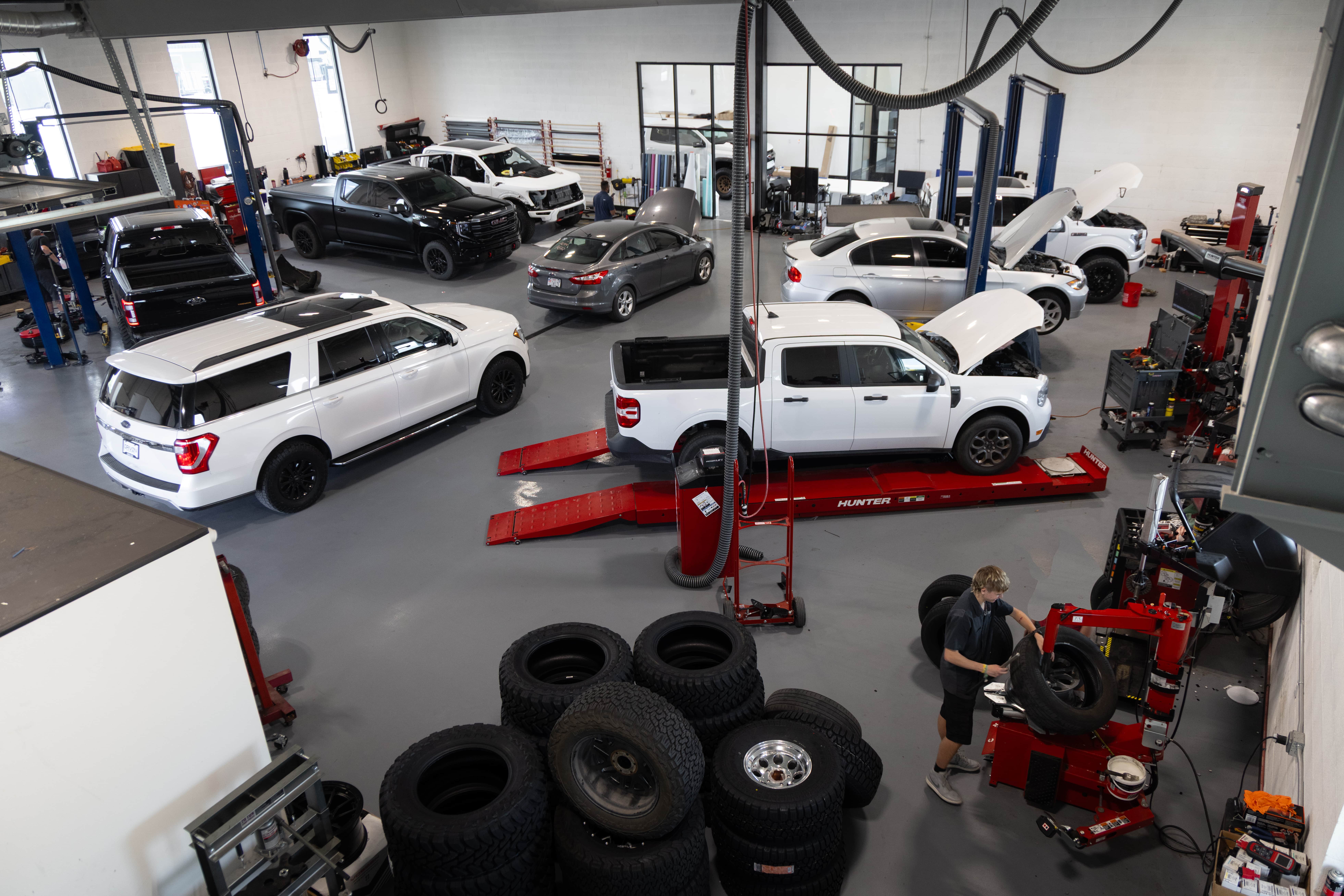 Porsche parked in front of a building- Driven Auto Sales Utah in Springville UT